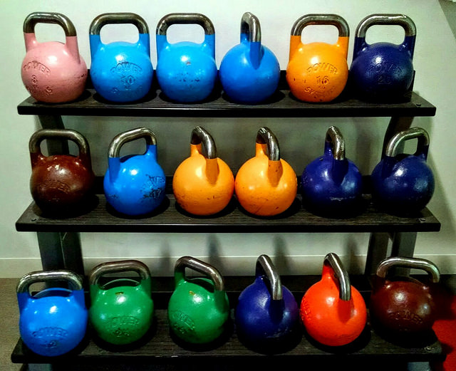 Home Gym kettlebell weights on rack