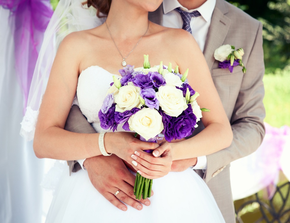 Wedding bouquet flowers in bride's hands
