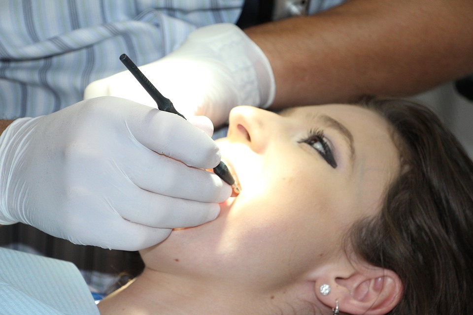 woman dentist visit mouth open