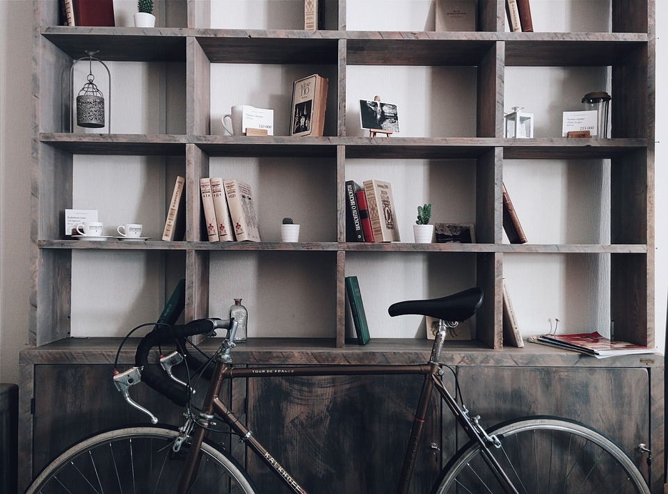 bookshelf and bike vintage home changes