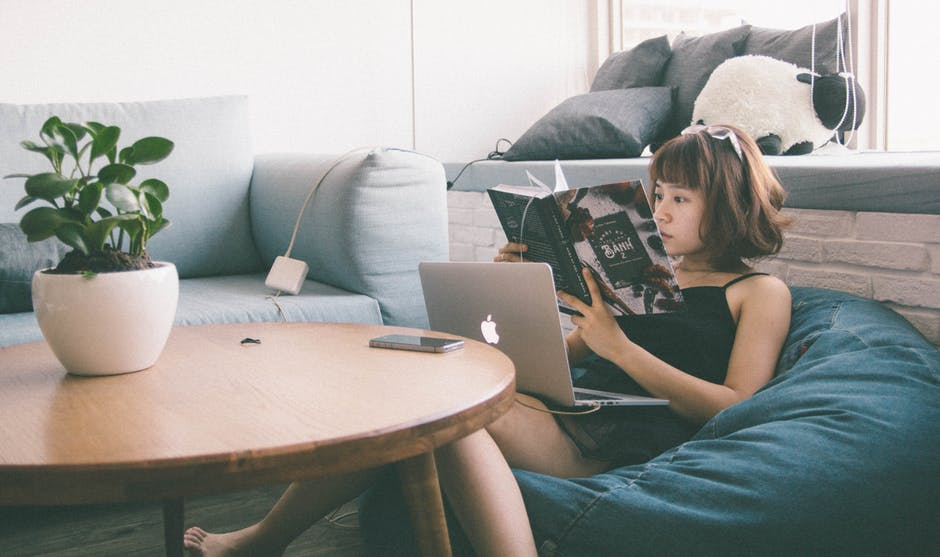 girl on macbook in 21st century home