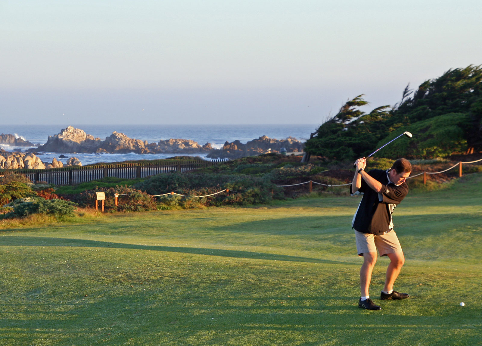 Monterey golfing over top of bluff