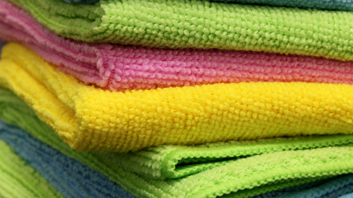 What is a microfiber clothes and how should I use it to clean my home?