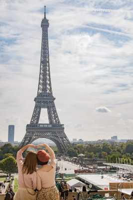 Friends hanging out in front of the Eiffel Tower